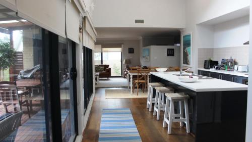 a kitchen with a counter and a dining room at Pet Friendly With Privacy, Excellence & Wifi in Hawks Nest