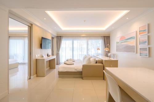 a hotel room with a bed and a sink at The Sea Cret Hua Hin in Hua Hin