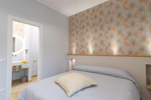 a bedroom with a bed with a wall mural at B&B Sylvie in Sora