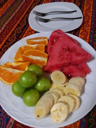 a plate of fruit and vegetables on a table at Paradise House in Pamukkale