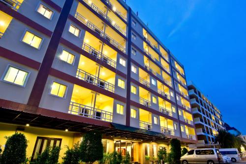 a large building with a parking lot in front of it at Golden Sea Pattaya - SHA Extra Plus in Pattaya Central