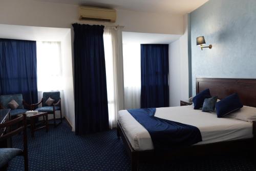 Postel nebo postele na pokoji v ubytování Amoun Hotel Alexandria