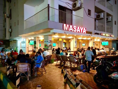 a group of people sitting in chairs in a restaurant at Masaya Hurghada in Hurghada