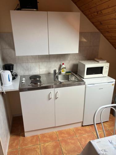 Kuchyň nebo kuchyňský kout v ubytování Afamado apartman Fisli