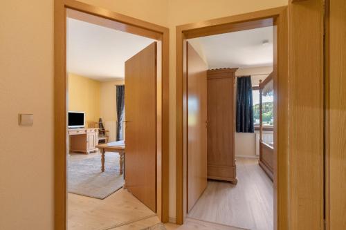 an open door into a room with a living room at Pension Bergblick in Marienberg