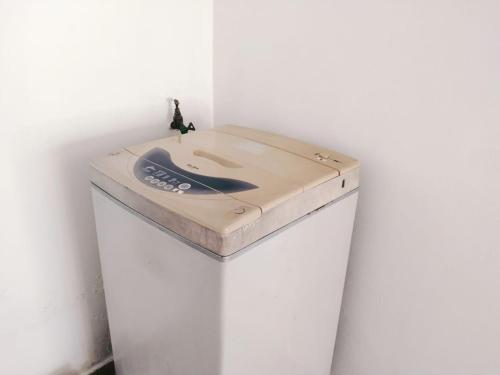 a bathroom counter with a sink on a white wall at Area Indahpura or Taman Bersatu Kulai 3-4BR near AEON Airport JPO in Kulai