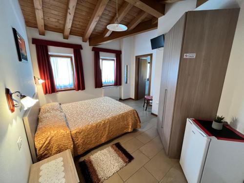 Postel nebo postele na pokoji v ubytování Agriturismo e Alloggi Luis Gianni