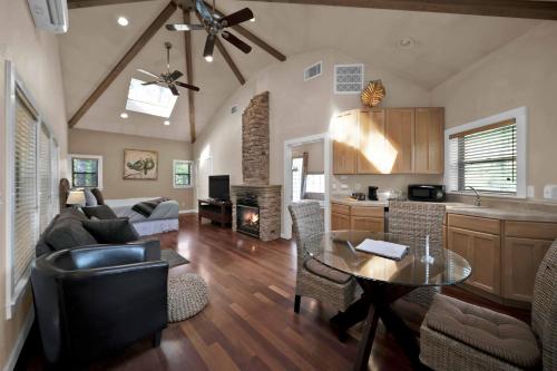 a kitchen and living room with a table and a couch at The Inn at Shasta Lake in Lakehead