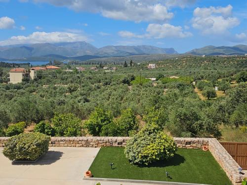 an aerial view of a yard with trees and mountains at Villa Athina in Gythio