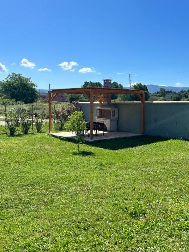 a backyard with a gazebo and a picnic table at Villa Marietta in Sidari
