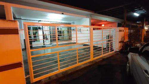 a view of the inside of a building with a fence at Area Indahpura or Taman Bersatu Kulai 3-4BR near AEON Airport JPO in Kulai