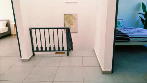 a staircase in a room with a tiled floor at Area Indahpura or Taman Bersatu Kulai 3-4BR near AEON Airport JPO in Kulai