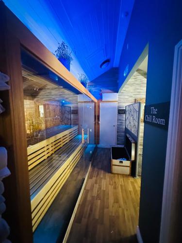 a room with a bowling alley with blue lights at Bridge House Hotel & Silver Howe View Cottage in Grasmere
