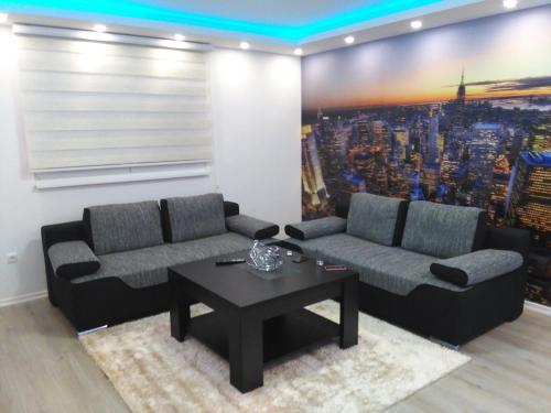a living room with two couches and a coffee table at Istočno Sarajevo in Sarajevo