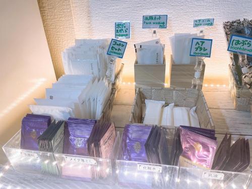a display of purple and white candles in boxes at Karuizawa Pension Sato no Nukumori in Karuizawa