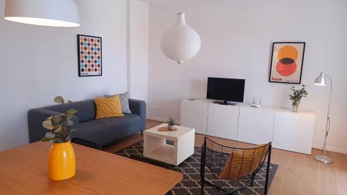 a living room with a couch and a table at Apartments Daria in Krk