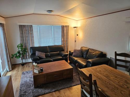 Et opholdsområde på Fijne chalet aan het bos!