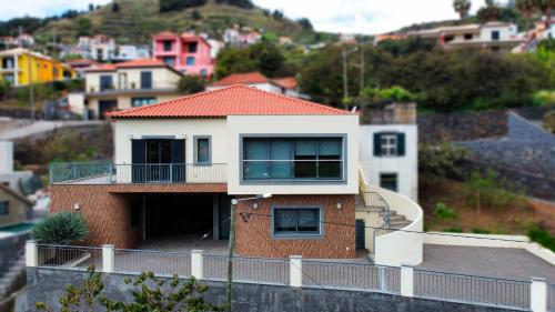 a house sitting on top of a hill at Capela's House in Ribeira Brava