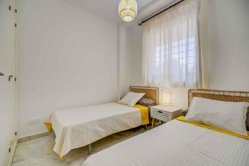 Ένα ή περισσότερα κρεβάτια σε δωμάτιο στο Beach View Challenge