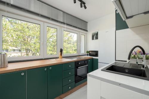 Η κουζίνα ή μικρή κουζίνα στο Stylowy Apartament w Łodzi by Noclegi Renters