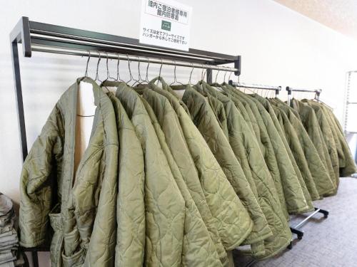 a row of jackets on racks in a room at Lupo Forest "GRAN FOREST Echizen Miyama" - Vacation STAY 06371v in Fukui