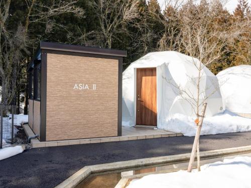 an igloo house with a door in the snow at Lupo Forest "GRAN FOREST Echizen Miyama" - Vacation STAY 07137v in Fukui