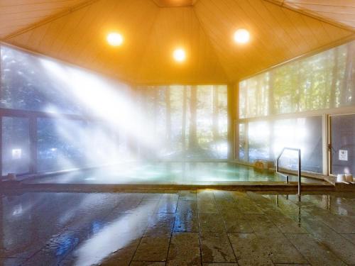 an empty room with a fountain in a building at Lupo Forest "GRAN FOREST Echizen Miyama" - Vacation STAY 07137v in Fukui