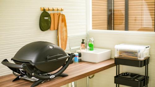 a helmet sitting on a counter in a kitchen at Lupo Forest "GRAN FOREST Echizen Miyama" - Vacation STAY 07137v in Fukui