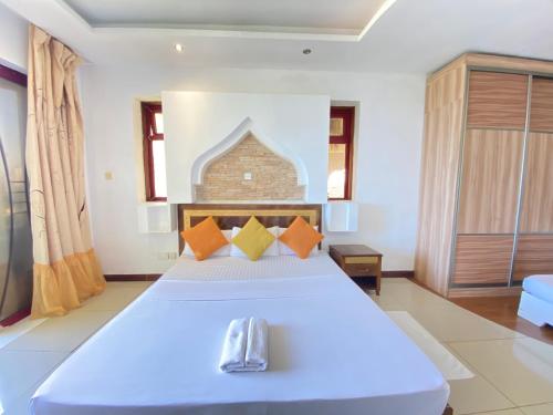 Postel nebo postele na pokoji v ubytování Seaside Beachfront Apartments