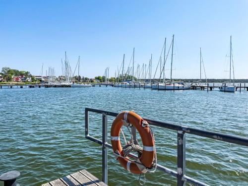 a life preserver on the side of a dock with boats at Apartment Kapitänskajüte by Interhome in Breege