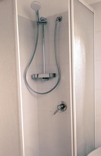 a shower with a shower head in a bathroom at B&B Casa Giardino Ferrazzano in Ferrazzano