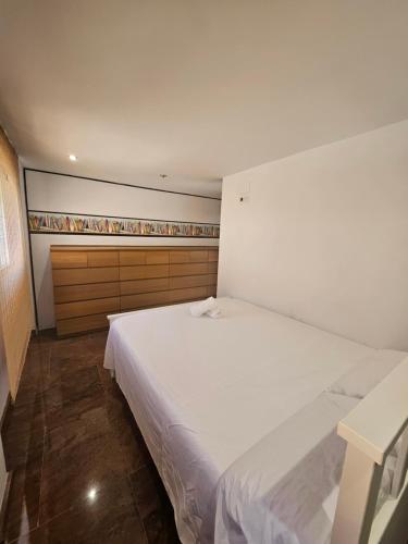 En eller flere senge i et værelse på Chalet adosado