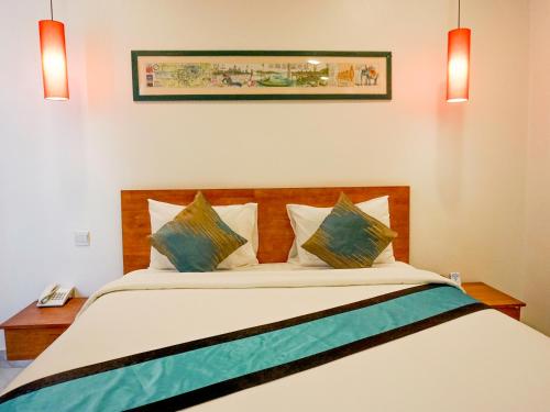 Una cama o camas en una habitación de Le Kree Downtown Hotel