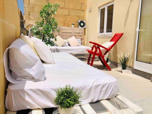 Llit o llits en una habitació de ! Amazing house in Sliema next to the beach !