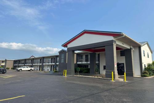 a parking lot in front of a hotel at Super 8 by Wyndham Monroe in Monroe
