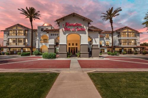 a building with a sign that reads hampton inn at Hampton Inn & Suites Phoenix-Goodyear in Goodyear