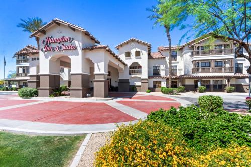 a building with a sign that reads hampton inn and suites at Hampton Inn & Suites Phoenix-Goodyear in Goodyear