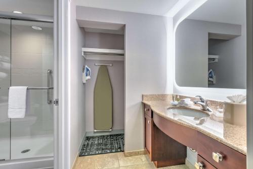 a bathroom with a shower and a sink at Homewood Suites - Rock Springs in Rock Springs