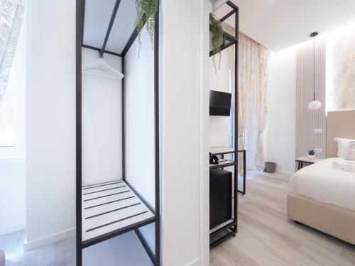 a room with a mirrored closet in a bedroom at White Ottaviano in Rome