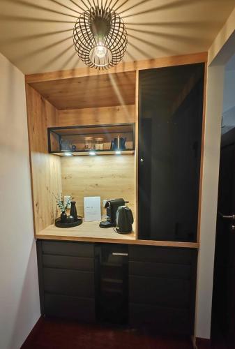 a kitchen with a counter with a coffee maker at Pension Donatus in Pirna