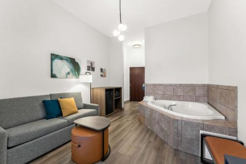 a living room with a couch and a tub at Comfort Inn & Suites in Tunkhannock