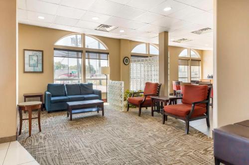 a lobby with chairs and a couch and a table at Comfort Inn & Suites Chesapeake - Portsmouth in Chesapeake