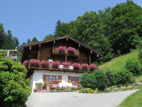 a house with flower boxes on the side of it at Haus Buchenwald in Ramsau