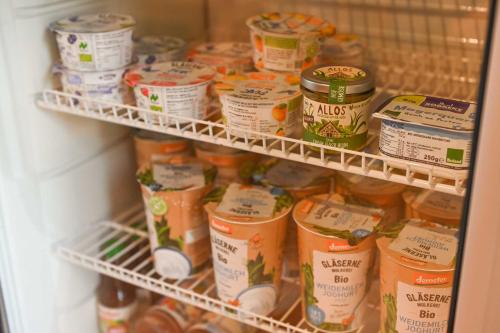 a refrigerator filled with lots of food at Tiny House Pioneer 1 - Salemer See in Salem