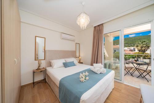 Postel nebo postele na pokoji v ubytování Arya Seaside Apartment