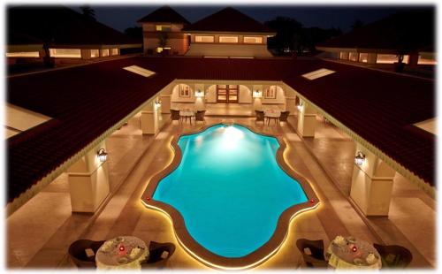 an overhead view of a swimming pool in a building at Neonz Resort & Club in Anand
