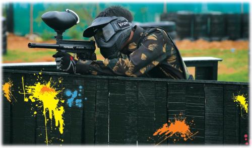 a man in a gas mask holding a gun at Neonz Resort & Club in Anand
