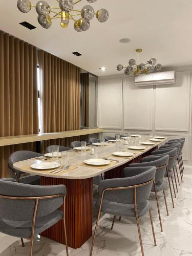 a conference room with a long table and chairs at Avioré Hotel Tacloban in Tacloban