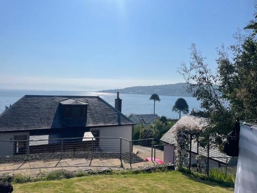 a house with a view of the water at Inverbeg Cottage in Rothesay