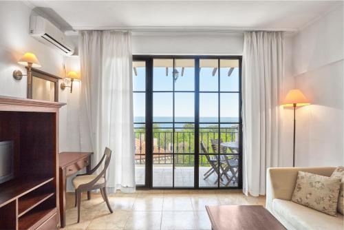 a living room with a room with a view of the ocean at The Cliff Hotel and Holiday Apartments by Flat Mаnаger in Obzor